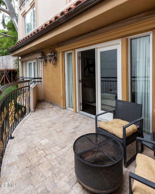 view of patio featuring a balcony