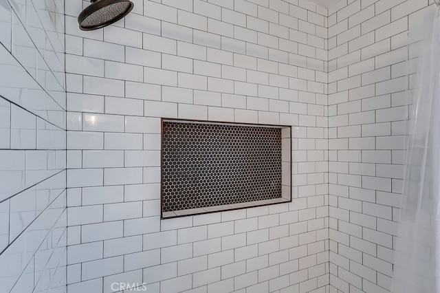 room details with a tile shower