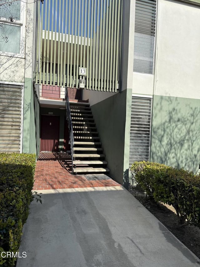 view of exterior entry with stucco siding
