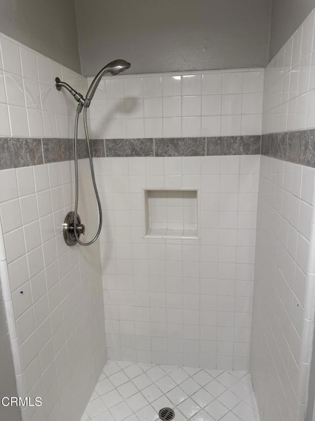 full bathroom with a tile shower