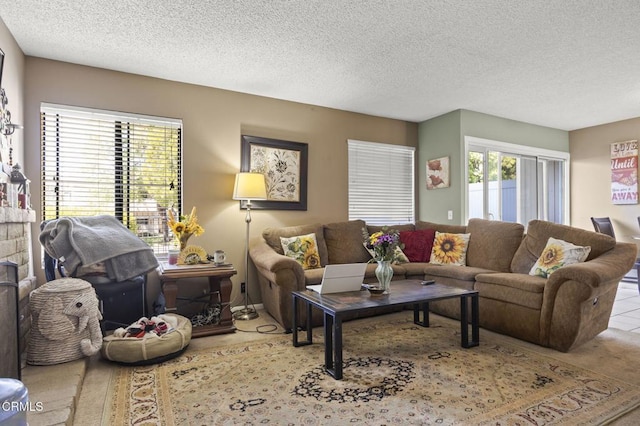 living area featuring a textured ceiling and tile patterned flooring