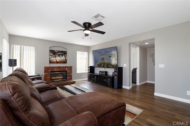 40824 Cobblestone Ct, Palmdale, CA 93551 - living room with ceiling fan, wood finished floors, baseboards, and a fireplace