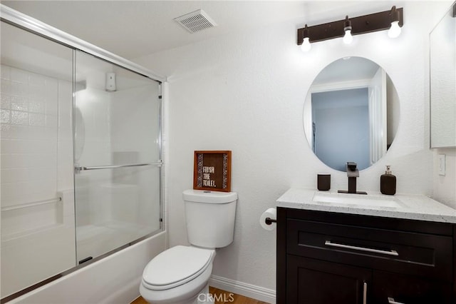 40824 Cobblestone Ct, Palmdale, CA 93551 - bathroom with toilet, vanity, baseboards, and bath / shower combo with glass door