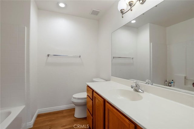 40824 Cobblestone Ct, Palmdale, CA 93551 - full bath featuring wood finished floors, toilet, vanity, baseboards, and recessed lighting