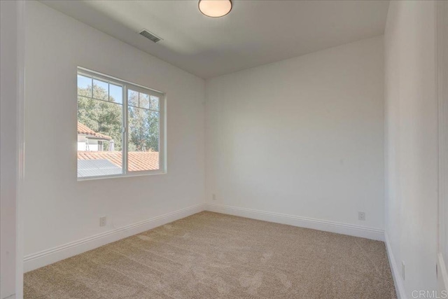 24321 Barona Mesa Rd, Ramona, CA 92065 - empty room featuring baseboards, light carpet, and visible vents