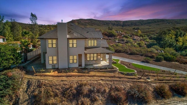 24321 Barona Mesa Rd, Ramona, CA 92065 - back of house featuring covered porch, a shingled roof, stucco siding, and fence