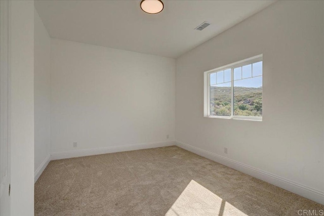 24321 Barona Mesa Rd, Ramona, CA 92065 - empty room featuring baseboards, visible vents, and light colored carpet