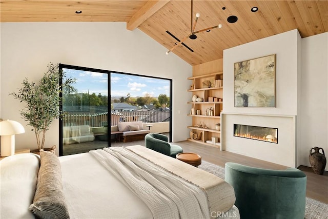 bedroom featuring a glass covered fireplace, wood finished floors, access to exterior, wood ceiling, and lofted ceiling with beams