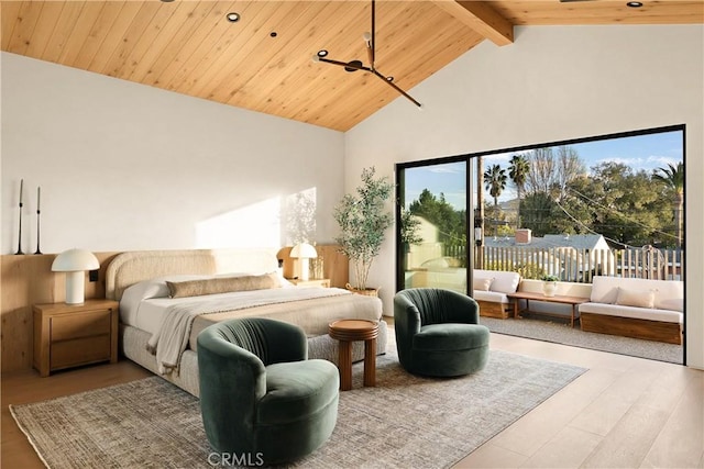 bedroom with high vaulted ceiling, beamed ceiling, wood ceiling, and wood finished floors