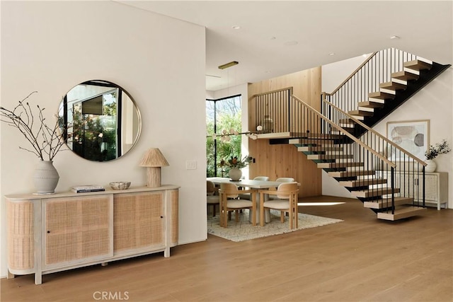 staircase with wood finished floors