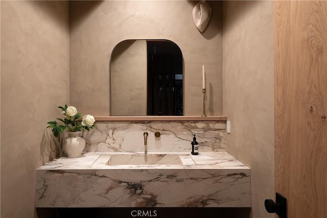 bathroom with tasteful backsplash