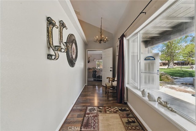 20130 Monte Vista Rd, Apple Valley, CA 92308 - corridor with dark wood-style floors, a notable chandelier, lofted ceiling, and plenty of natural light