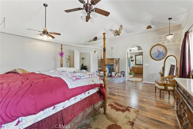 20130 Monte Vista Rd, Apple Valley, CA 92308 - bedroom with arched walkways, baseboards, vaulted ceiling, and wood finished floors
