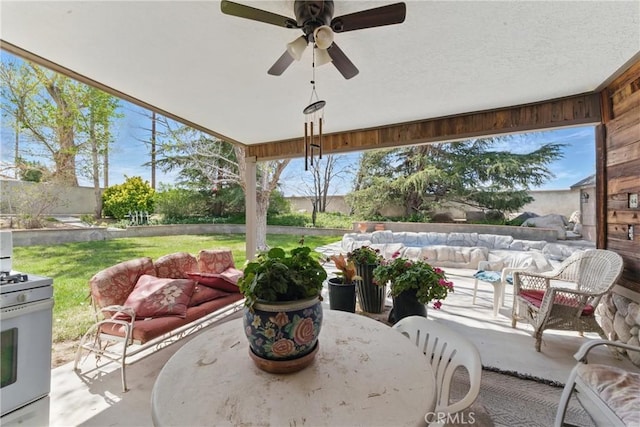 20130 Monte Vista Rd, Apple Valley, CA 92308 - view of patio featuring a ceiling fan, an outdoor hangout area, and outdoor dining area