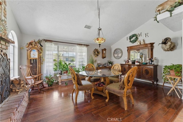 20130 Monte Vista Rd, Apple Valley, CA 92308 - dining space with visible vents, a wealth of natural light, hardwood / wood-style floors, and vaulted ceiling