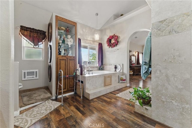 20130 Monte Vista Rd, Apple Valley, CA 92308 - full bath with a bath, baseboards, toilet, vaulted ceiling, and wood-type flooring