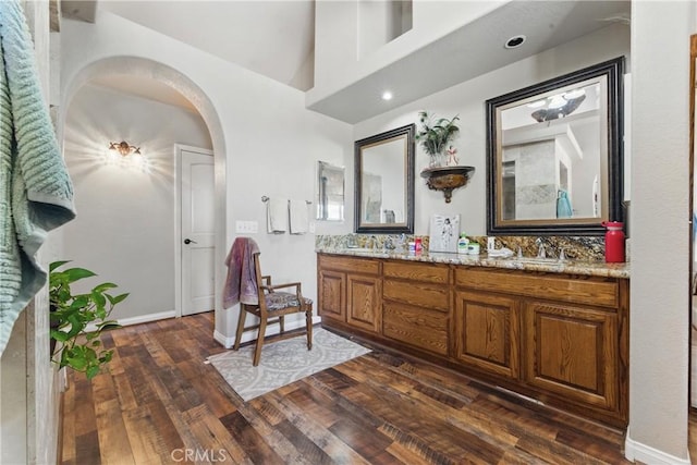 20130 Monte Vista Rd, Apple Valley, CA 92308 - bathroom with wood-type flooring, double vanity, a sink, and baseboards