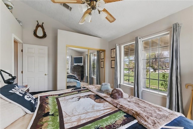 20130 Monte Vista Rd, Apple Valley, CA 92308 - bedroom with ceiling fan, a textured ceiling, a closet, visible vents, and lofted ceiling