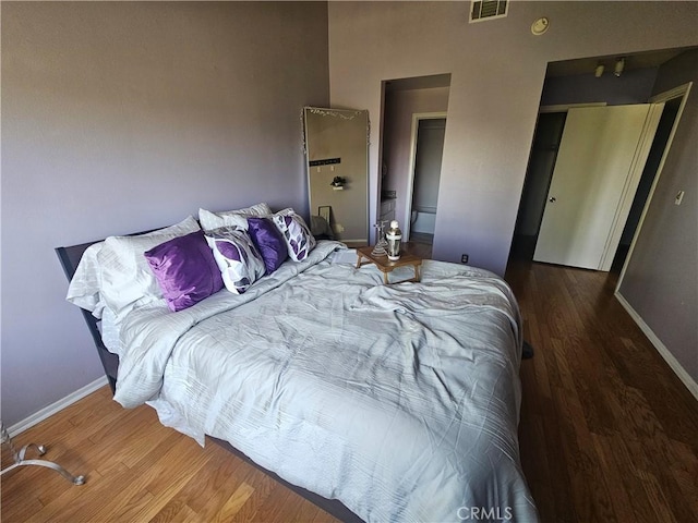 803 E Victoria St Unit 103, Carson, CA 90746 - bedroom with baseboards and wood finished floors