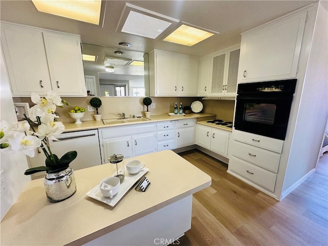 13201 El Dorado Dr Unit M9-207G, Seal Beach, CA 90740 - kitchen with a sink, white appliances, and white cabinets