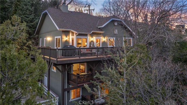 813 Brentwood Dr, Lake Arrowhead, CA 92352 - rear view of property with roof with shingles, a wooden deck, and a chimney