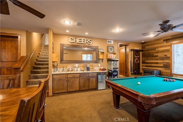 813 Brentwood Dr, Lake Arrowhead, CA 92352 - recreation room featuring beverage cooler, ceiling fan, wet bar, wood walls, and light carpet
