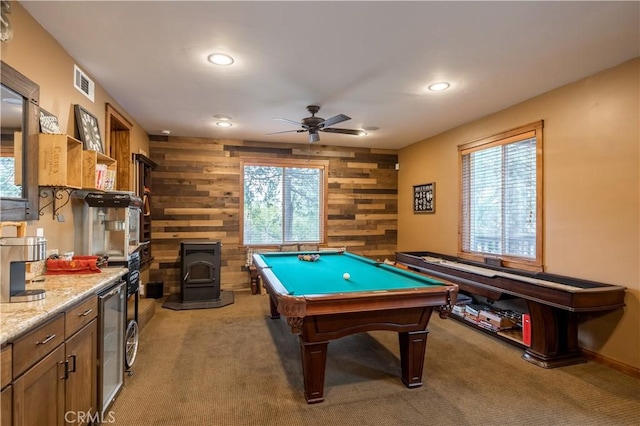 813 Brentwood Dr, Lake Arrowhead, CA 92352 - game room with wood walls, a wood stove, light carpet, wine cooler, and recessed lighting