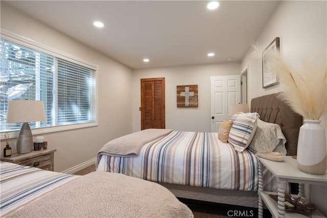 bedroom featuring carpet flooring, baseboards, and recessed lighting