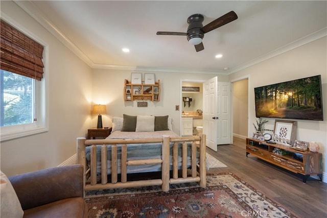 bedroom featuring crown molding, ensuite bathroom, recessed lighting, wood finished floors, and baseboards