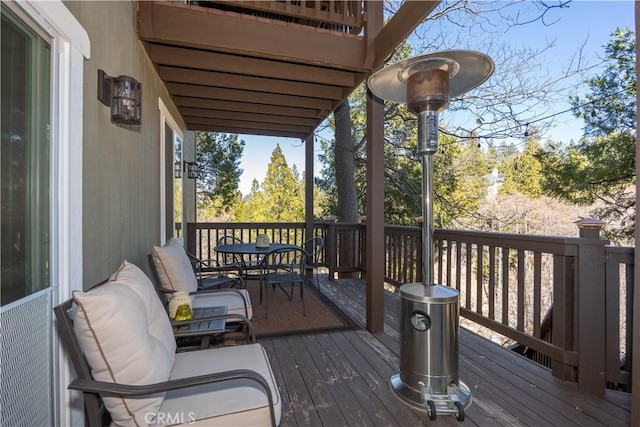 deck with outdoor dining area