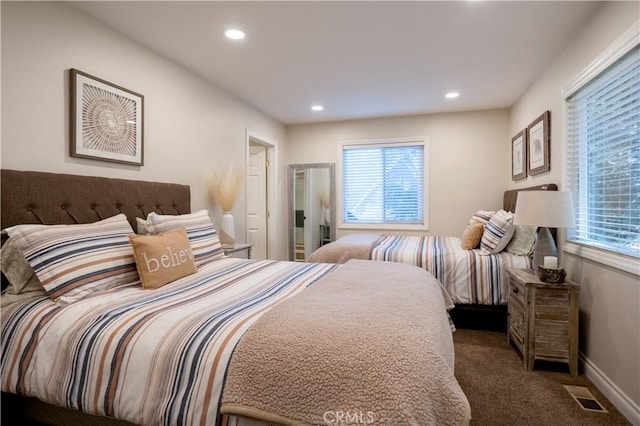 carpeted bedroom with recessed lighting, visible vents, and baseboards