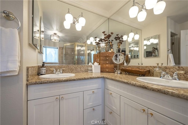 813 Brentwood Dr, Lake Arrowhead, CA 92352 - bathroom featuring a chandelier, a shower stall, double vanity, and ornamental molding