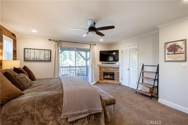 carpeted bedroom with baseboards, a stone fireplace, crown molding, recessed lighting, and access to exterior