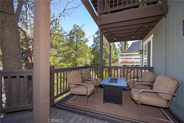 deck with an outdoor fire pit
