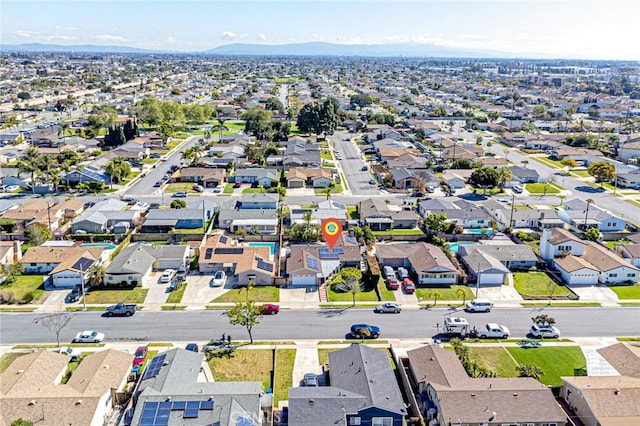 aerial view of residential area with mountains