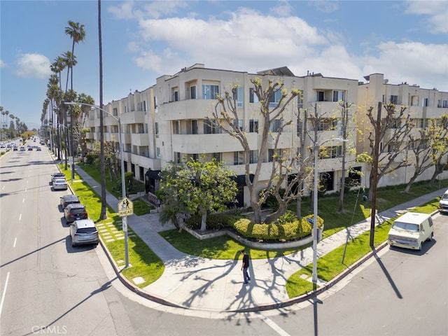 19350 Sherman Way Unit 114, Reseda, CA 91335 - view of building exterior with uncovered parking