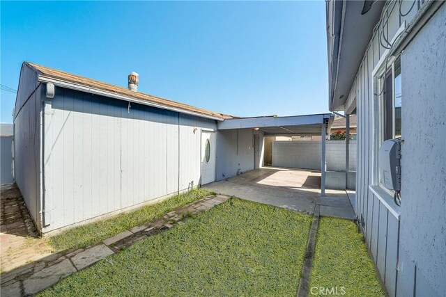 6160 California Ave, Long Beach, CA 90805 - view of side of property with a yard, a patio area, and fence