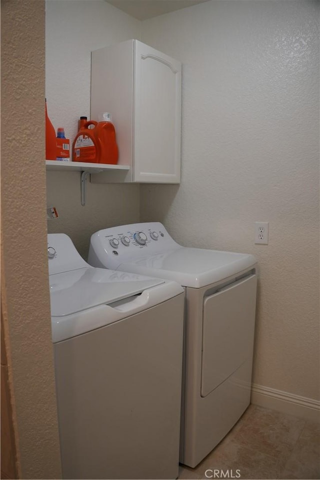 22234 S Vermont Ave Unit 203B, Torrance, CA 90502 - laundry room featuring washer and clothes dryer, cabinet space, and baseboards