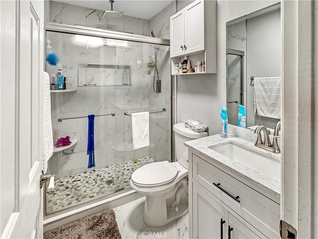 7455 Bangor Ave, Hesperia, CA 92345 - full bathroom with a marble finish shower, vanity, and toilet