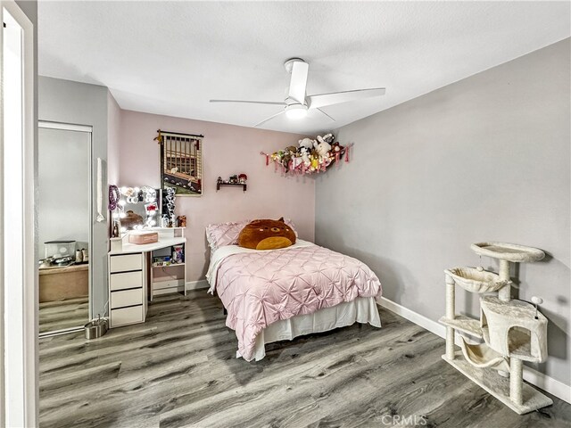 7455 Bangor Ave, Hesperia, CA 92345 - bedroom with a ceiling fan, baseboards, and wood finished floors