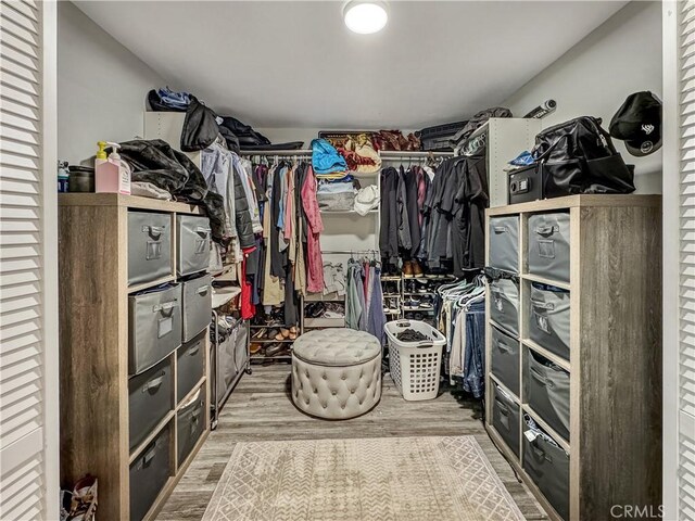 7455 Bangor Ave, Hesperia, CA 92345 - walk in closet featuring wood finished floors
