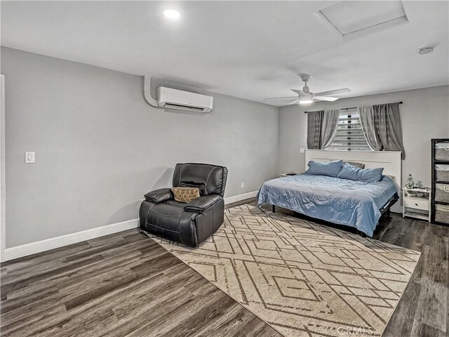 7455 Bangor Ave, Hesperia, CA 92345 - bedroom featuring baseboards, attic access, a wall mounted air conditioner, and wood finished floors