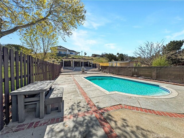 7455 Bangor Ave, Hesperia, CA 92345 - view of pool with a fenced backyard, a fenced in pool, and a patio