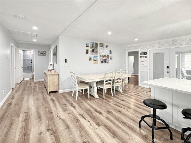 7455 Bangor Ave, Hesperia, CA 92345 - dining space with french doors, recessed lighting, baseboards, light wood-type flooring, and visible vents