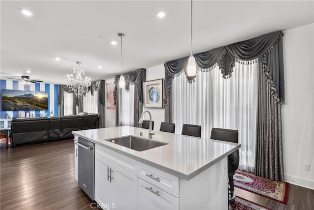 16614 Trailblazer Ave, Chino, CA 91708 - kitchen featuring dark wood finished floors, a kitchen island with sink, light countertops, a sink, and open floor plan