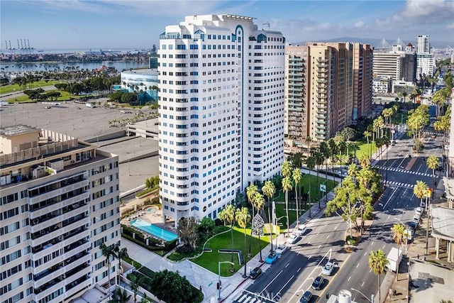 birds eye view of property featuring a view of city and a water view