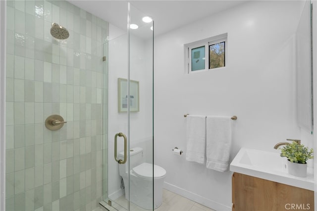 full bathroom with tile patterned floors, toilet, a shower stall, and vanity