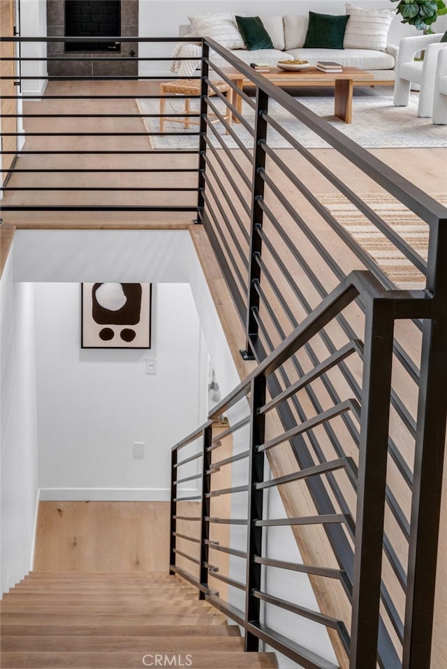 staircase featuring wood finished floors