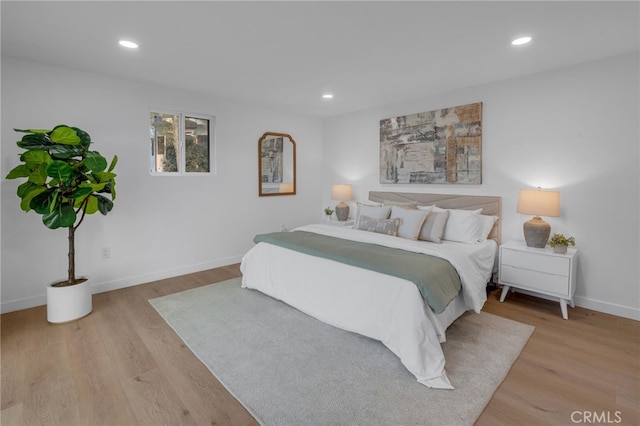 bedroom with light wood-type flooring and recessed lighting