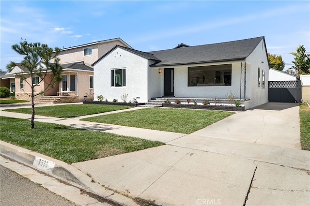 3533 Deerford St, Lakewood, CA 90712 - view of front of home with stucco siding and a front lawn